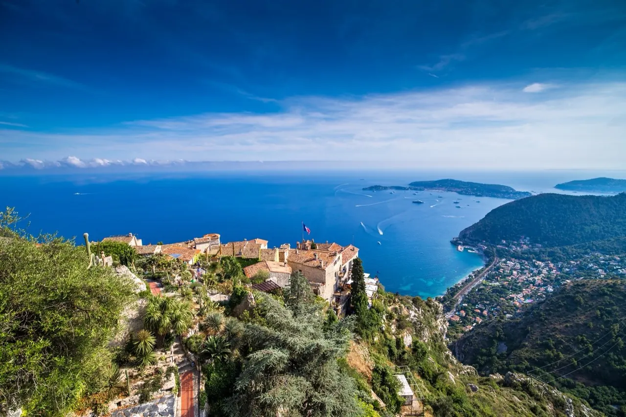 Èze village above the Mediterranean, the coast reaching towards Cap-Ferrat